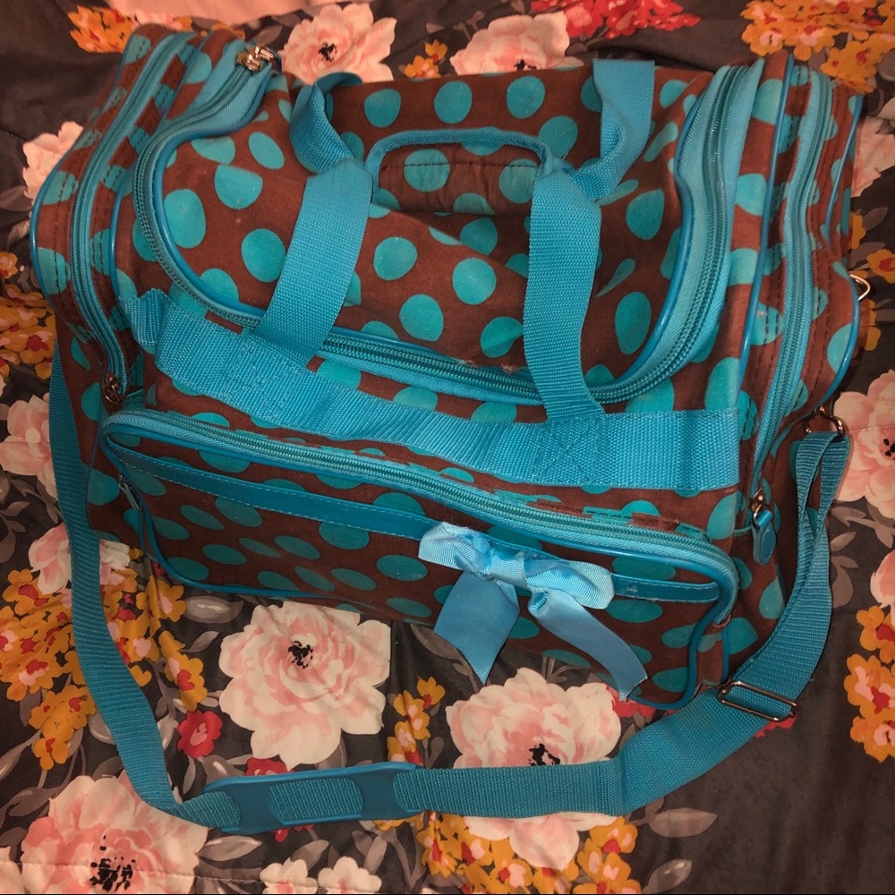 Brown and blue polkadot duffel bag
